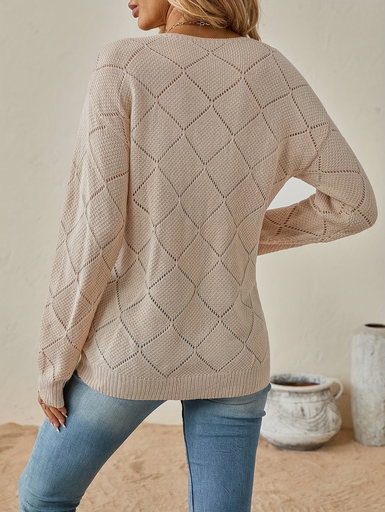 Elegant openwork v-neck sweater